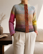 One-of-a-kind multicolour crochet cardigan with hand-composed gradient transitions and a contrasting button placket.