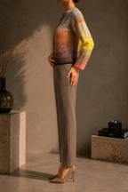 Side view of the handmade gradient crochet cardigan showing its hip-length silhouette and long sleeves.
