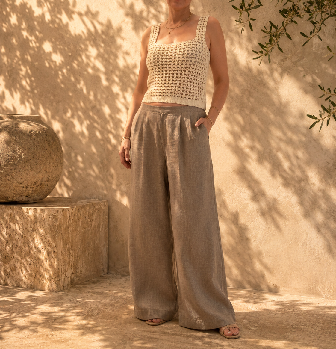Front styled view of the handmade ivory crochet tank top showing the square neckline and decorative openwork hem.