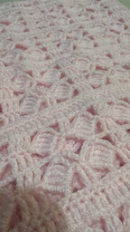 Close-up of the light pink Size 2 crochet vest showing its durable acrylic yarn and decorative openwork texture.