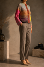 Front styled view of the multicolour crochet cardigan showing its fitted shape and six-button closure.