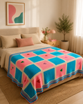 Large handmade Tunisian crochet heart blanket displayed across a bed in a warm contemporary bedroom.