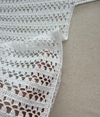 Close-up of the handmade crochet blouse showing the right-angle underarm construction and transition between body and sleeve.