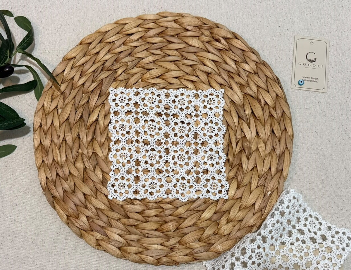 Small square white crochet doily styled beside a larger matching piece, showing the coordinated motif design across different sizes.