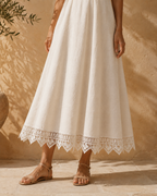 White crochet lace border styled at the hem of a skirt as an example of garment application.