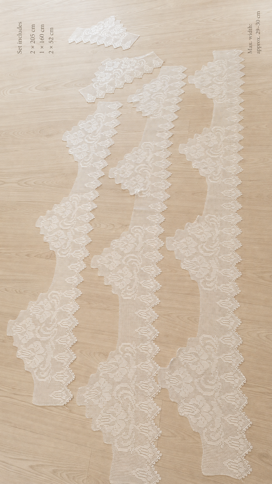 Five-piece white crochet lace edge set laid flat to show the stepped repeat sections, pointed borders and different lengths.